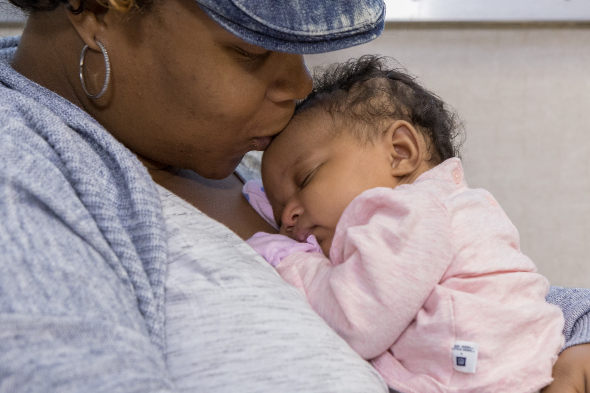 woman kissing baby